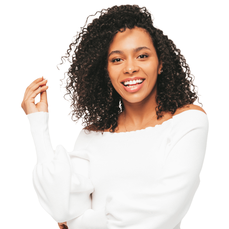 A beautiful woman with full hair and a big smile.